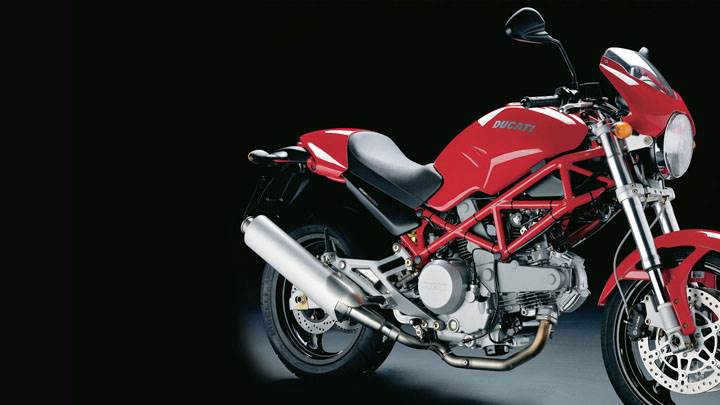 Ducati Monster 620 2005 in Red Side Pose And Black Background